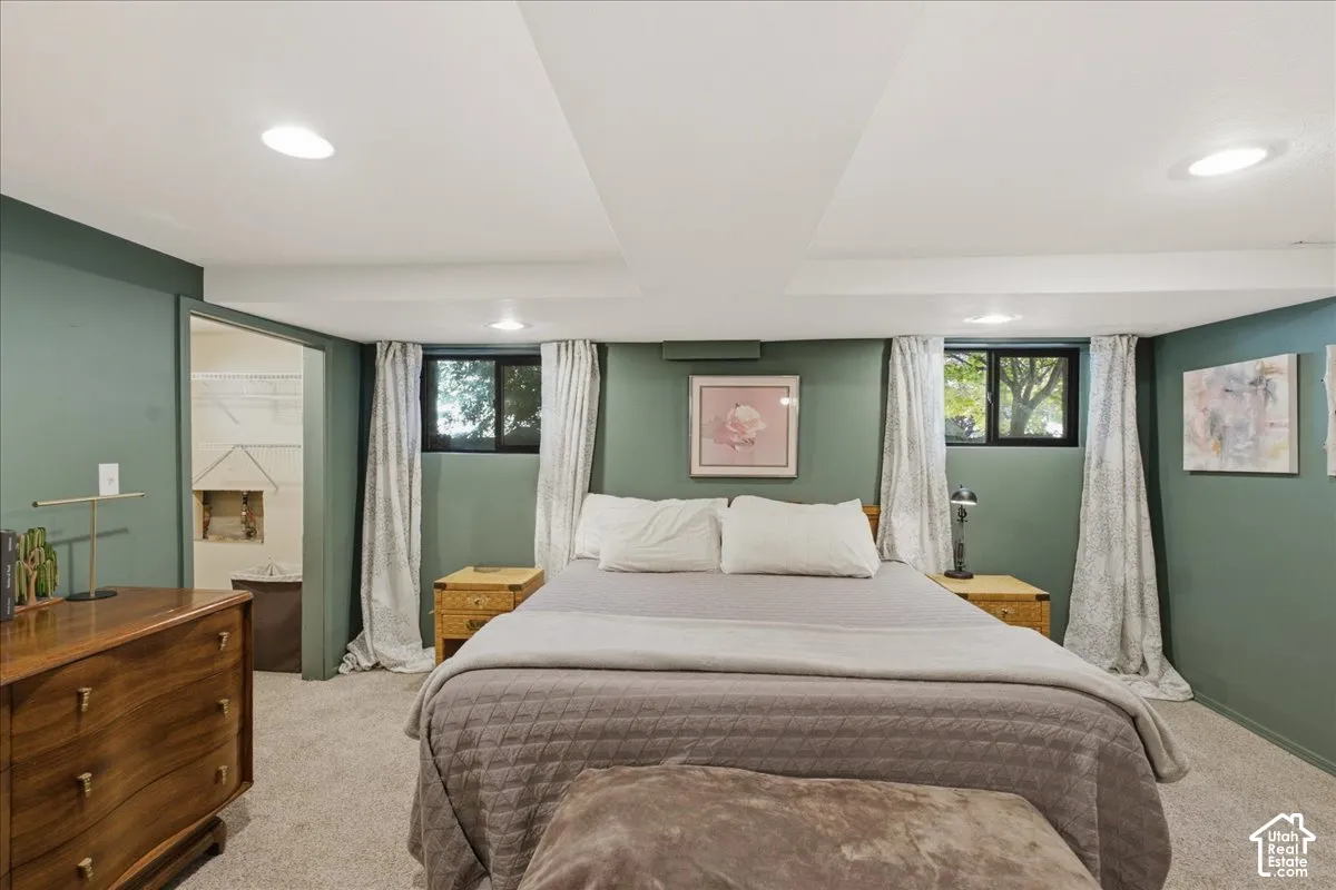 Recessed lighting, wall-to-wall carpeting, and two windows