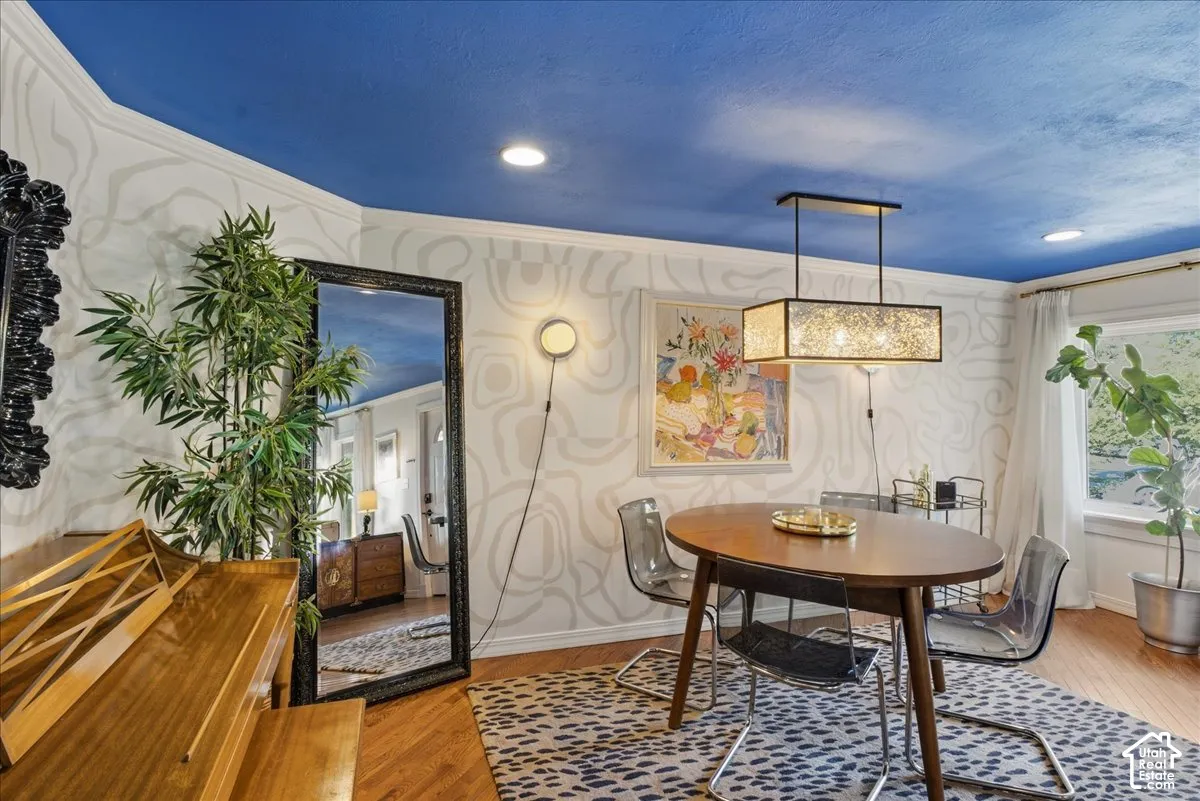 Wood-finish flooring, recessed ceiling lighting, and crown molding