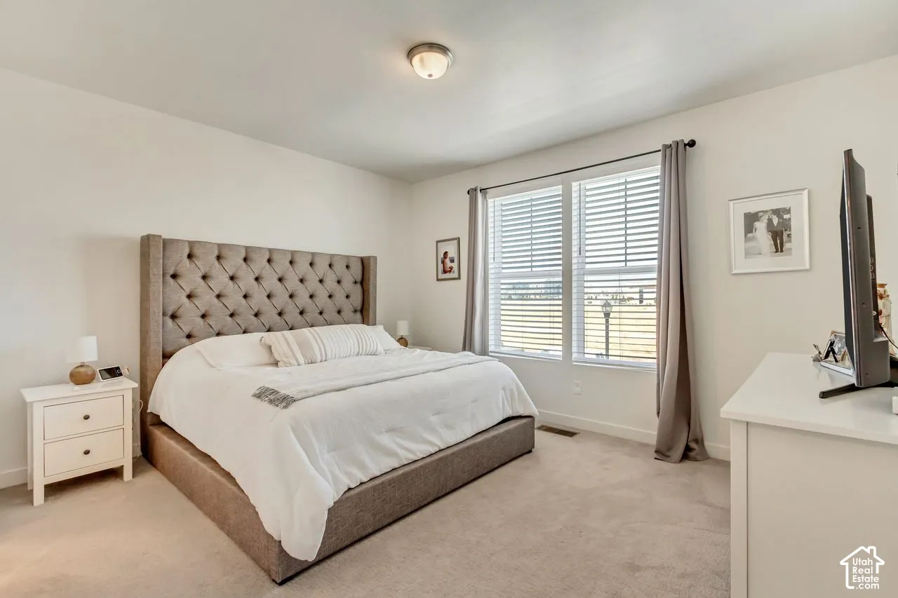 Carpeted flooring, recessed window, and flush mount lighting