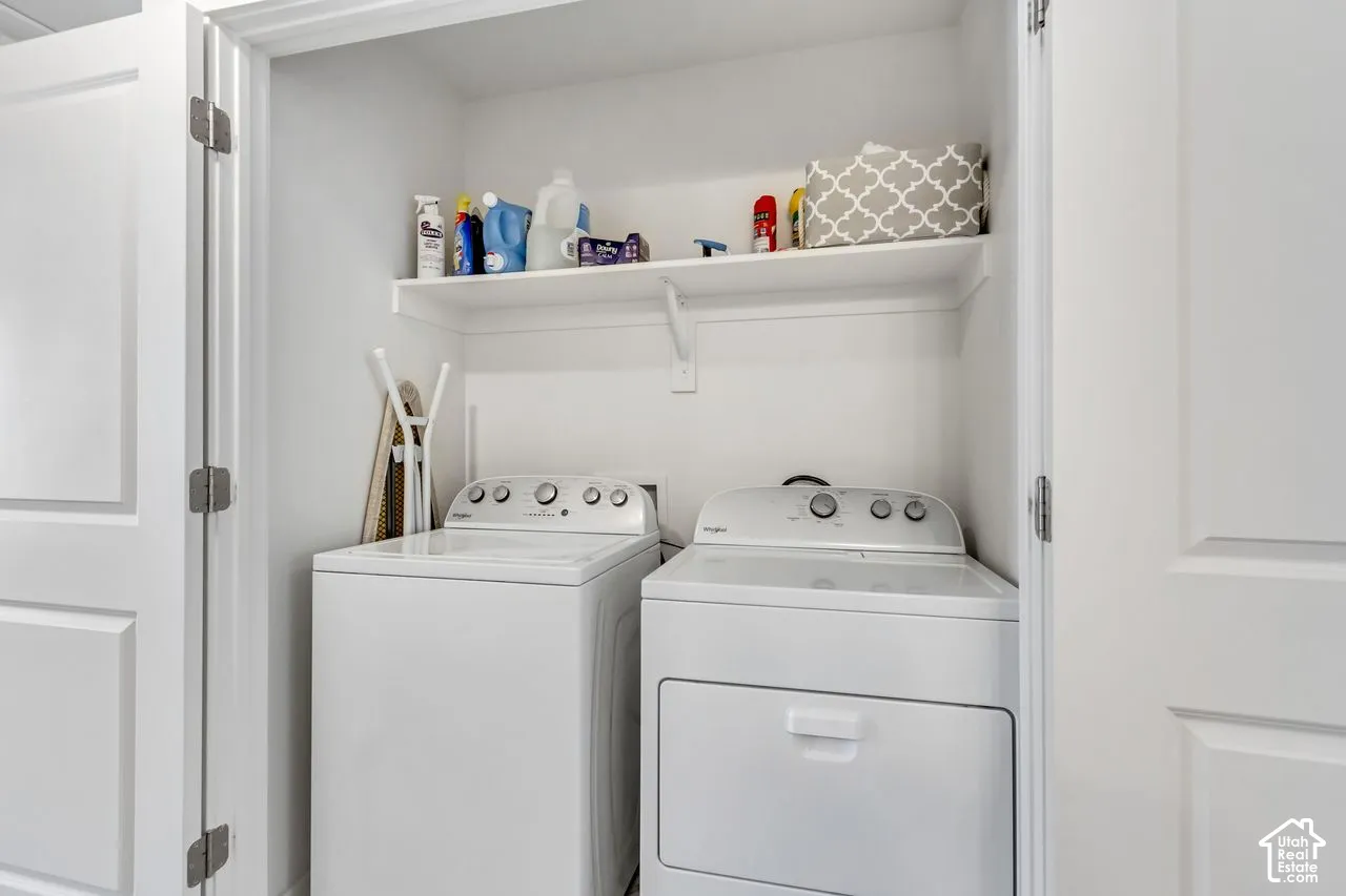 Dedicated laundry closet with a built-in shelf