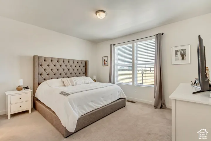Carpeted flooring, recessed window, and flush mount lighting
