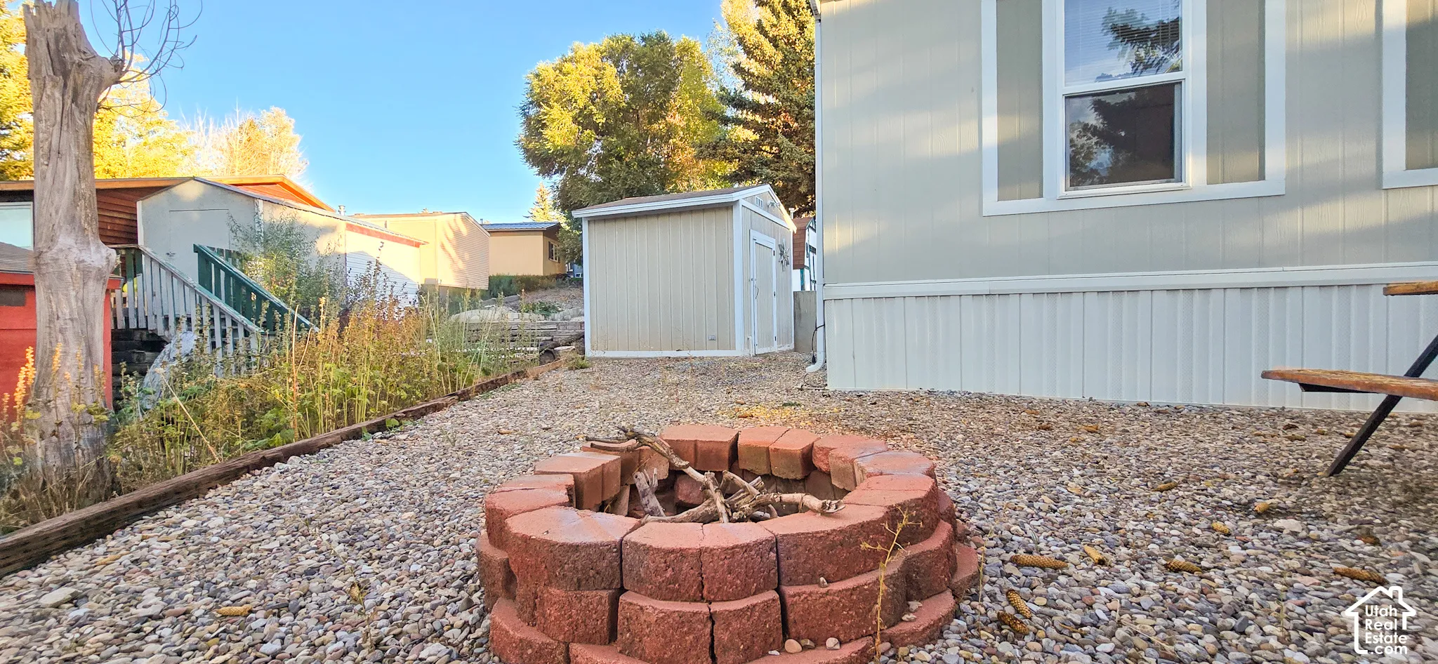 Gravel ground cover with a brick-built fire pit