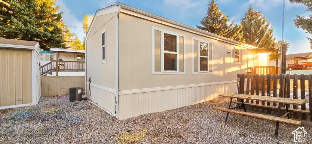 Light-colored exterior siding with white trim