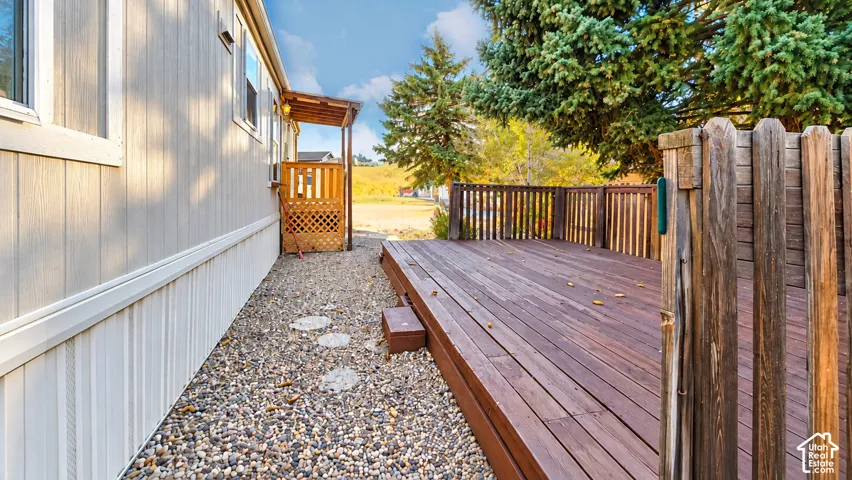 Expansive wooden deck with coordinating wooden fence