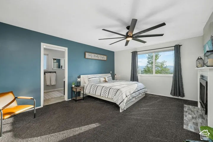 Recessed lighting, ceiling fan, and large window with exterior scenery