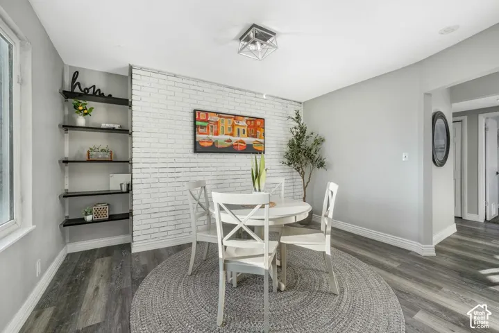 Accent brick wall with wood-finish flooring