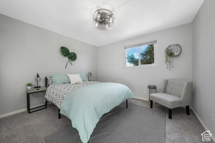 Light gray walls complement carpeted flooring