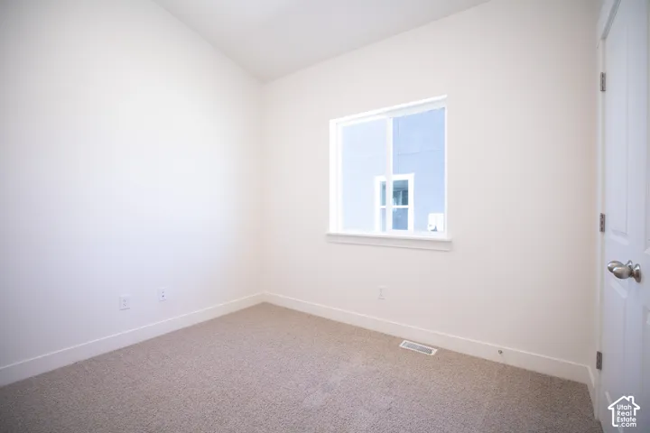 Bedroom #2 with vaulted ceiling and large closet.