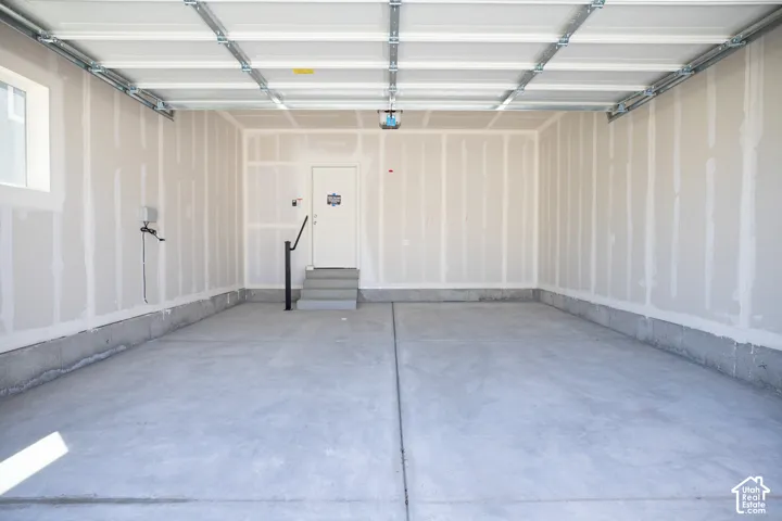 Two car garage with taped finish.