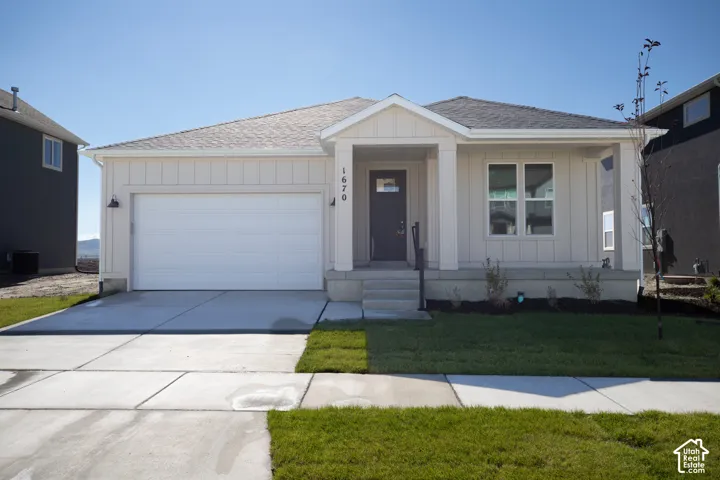 Granite Elevation A with extended porch and front yard landscaping installed.