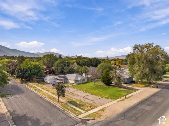 Expansive lot with mature trees and a manicured lawn