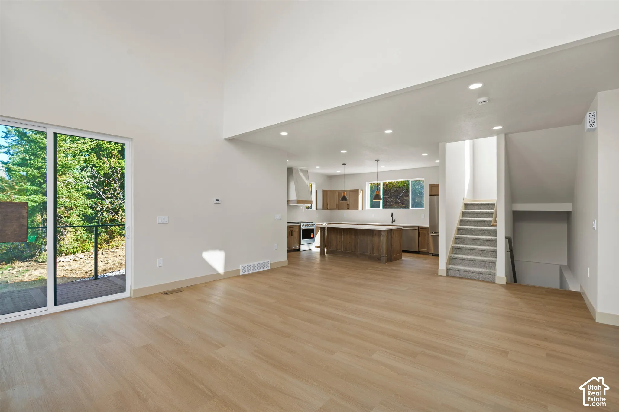High ceilings with wood-finish flooring