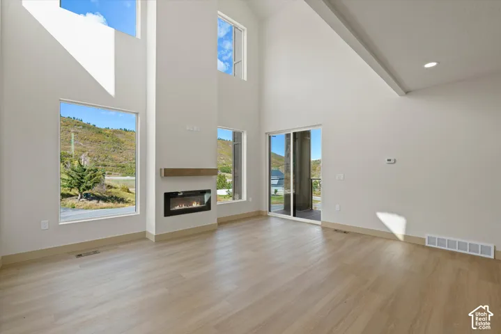 Soaring vaulted ceilings with recessed lighting