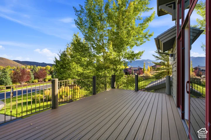 Expansive outdoor deck featuring composite decking and decorative metal railings