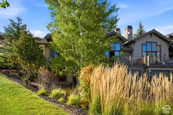 Multi-story exterior with stucco and siding elements