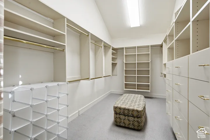 Custom closet system featuring built-in shelving, hanging rods, and integrated drawer storage
