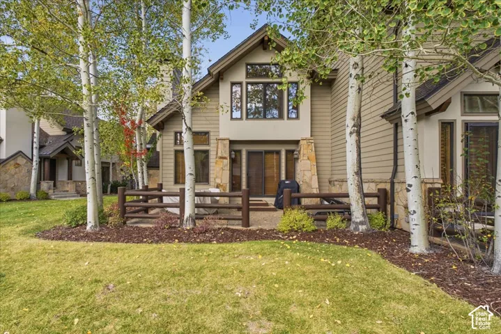 Multi-level exterior featuring stone cladding and siding