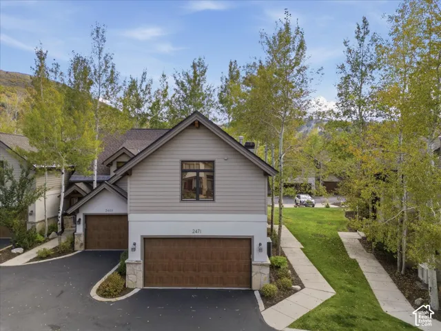 Contemporary exterior with multiple gables and neutral siding