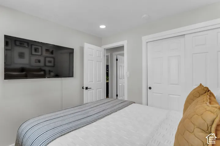 Recessed ceiling lighting, paneled interior doors, and white trim