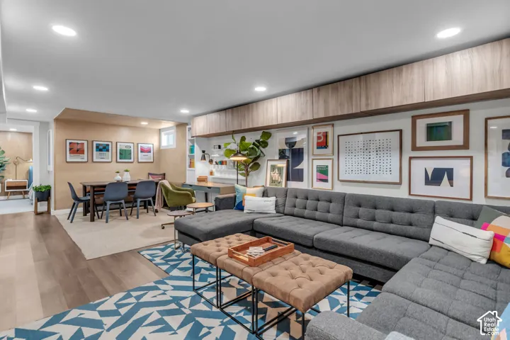 Recessed lighting illuminates the open-concept living space