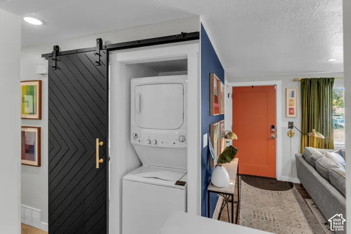 Black barn door with gold-toned hardware