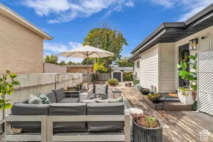 Expansive wood-finish deck with outdoor lighting fixtures