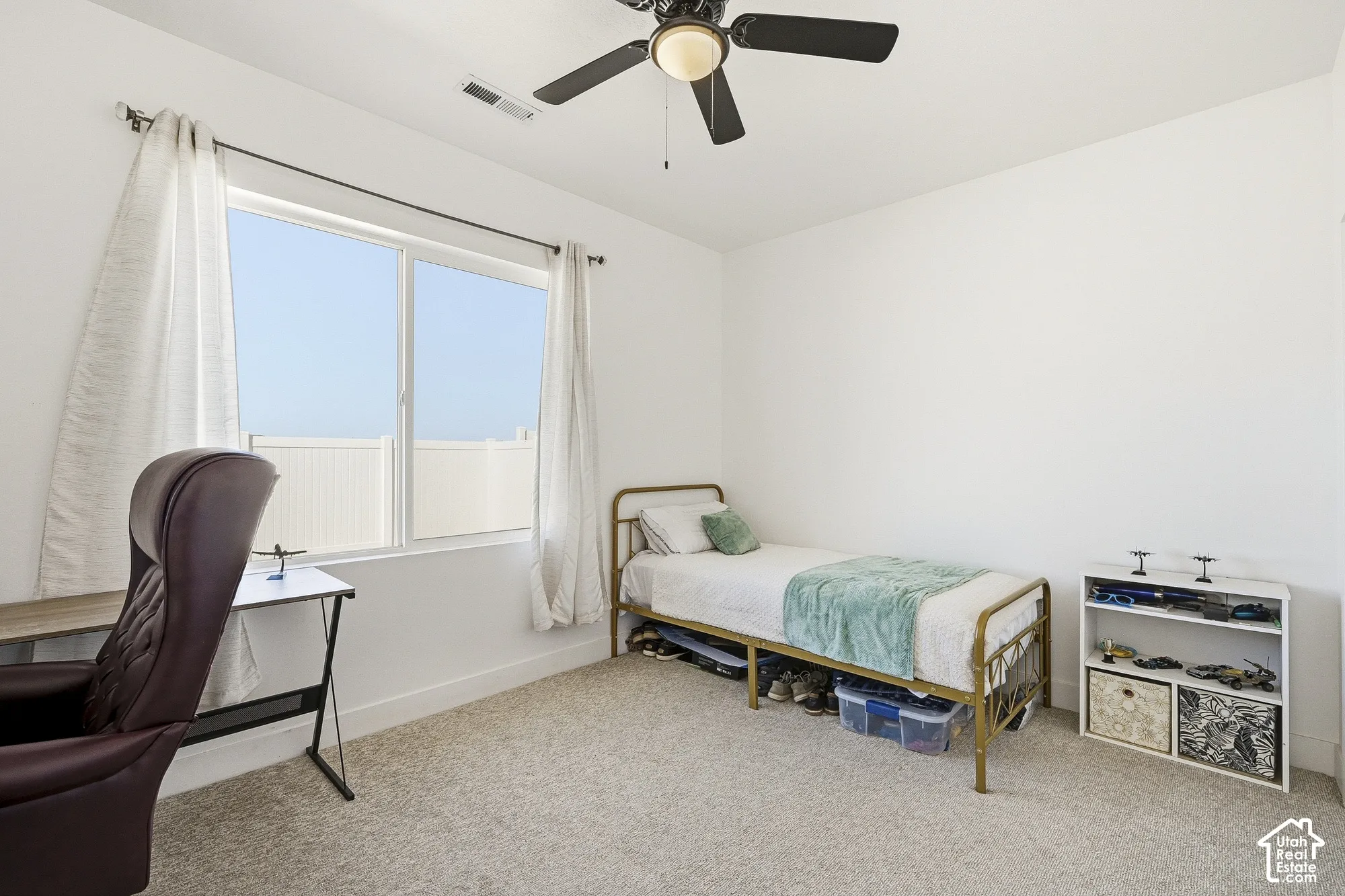 Recessed lighting, wall-to-wall carpeting, and a ceiling fan with integrated lighting