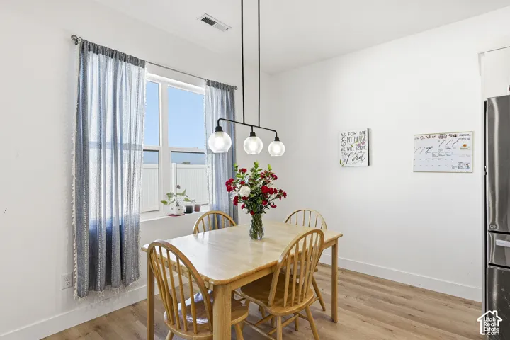 White walls with wood-finish flooring