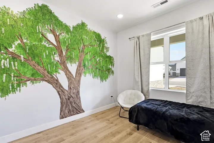 Wood-finish flooring with a white baseboard trim