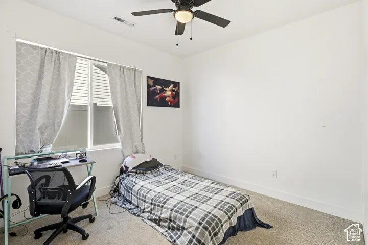 Recessed window with white blinds, neutral wall paint, and a ceiling fan