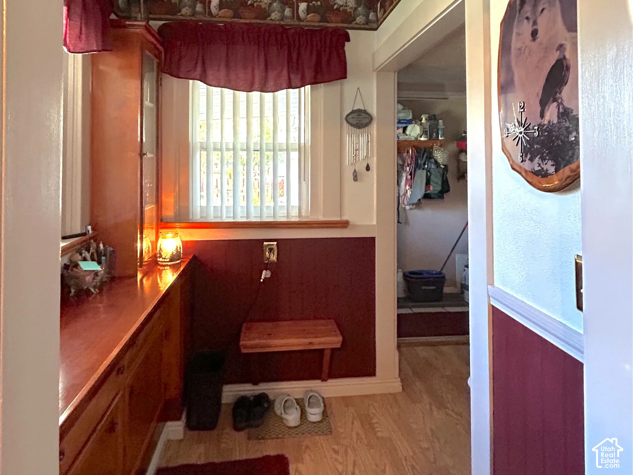 Wood-finish flooring, built-in cabinetry in the laundry room.