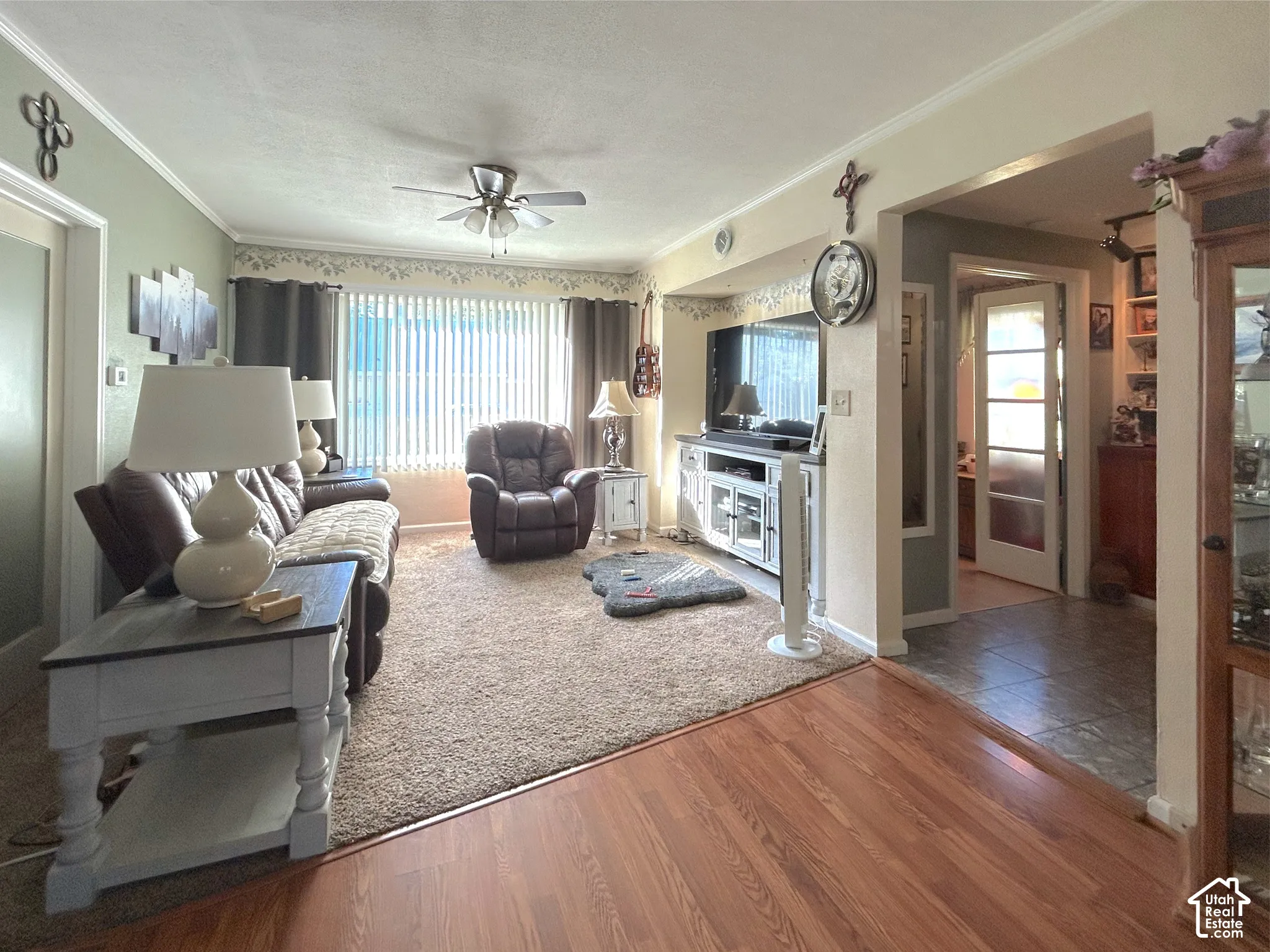 Warm wood-finish flooring and plush carpeting