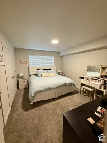 Recessed lighting, neutral wall paint, carpeted flooring, and window blinds