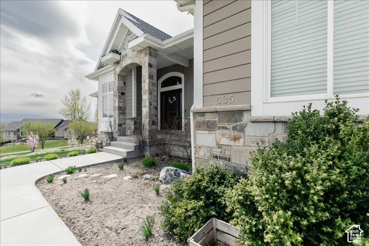 Stone and siding exterior with covered entry