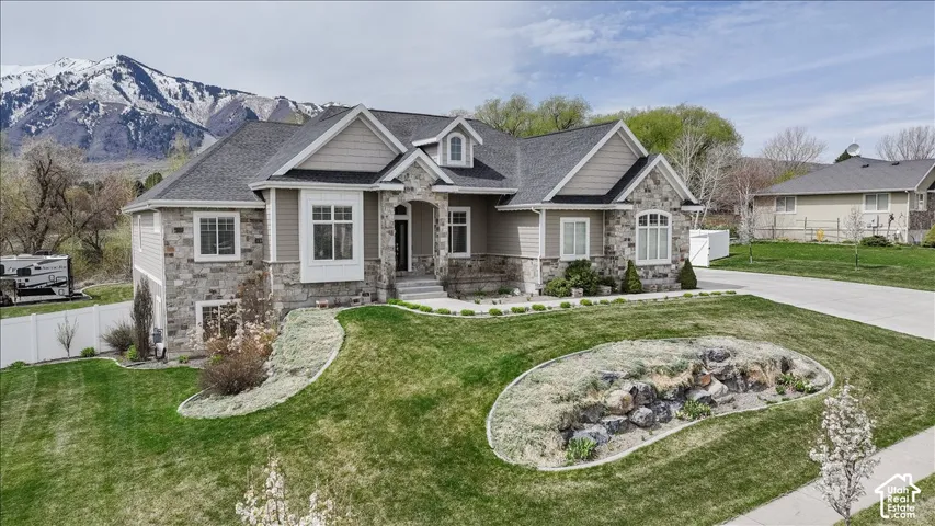 Stone and siding exterior with a multi-gabled roofline
