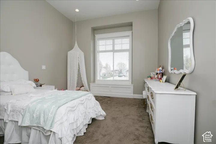 Recessed window with white plantation shutters and built-in window seating