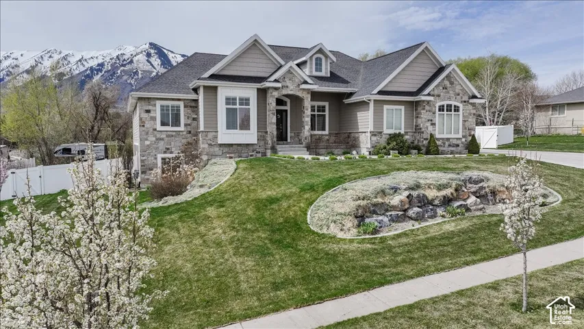 Stone and siding exterior with gabled roof lines