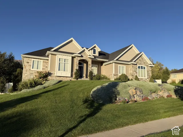 Stone and siding exterior with gabled roof lines