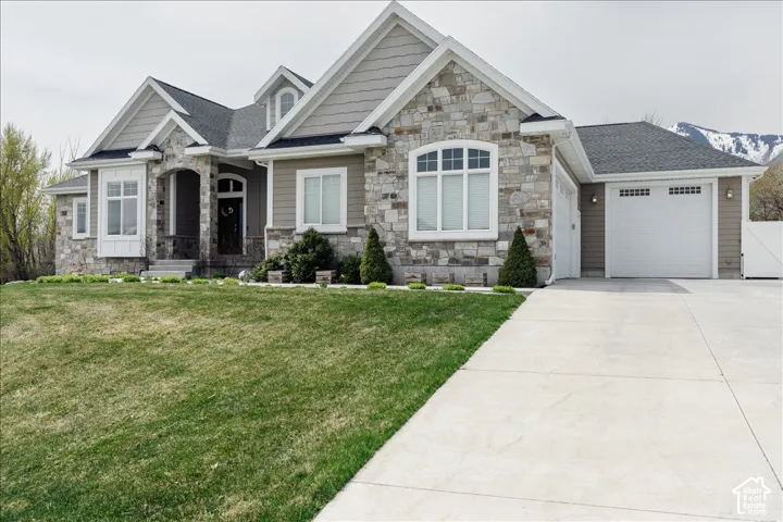 Stone and siding exterior with gabled roof lines