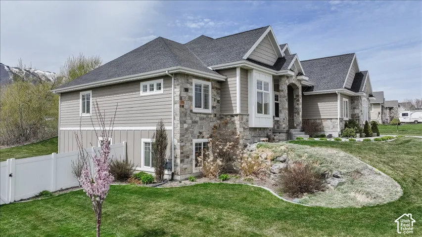 Stone and siding exterior with multiple gables