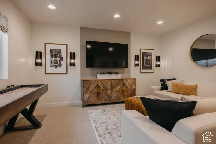 Recessed lighting illuminates the carpeted floor