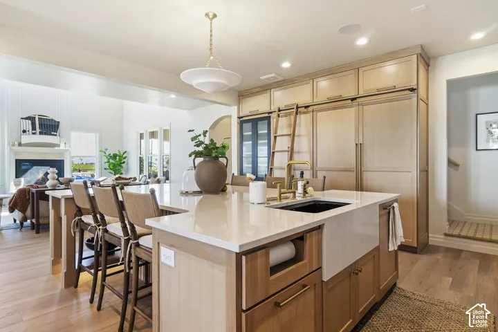 Expansive kitchen island with a built-in sink and countertop seating