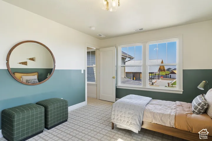 White trim window overlooking the neighborhood