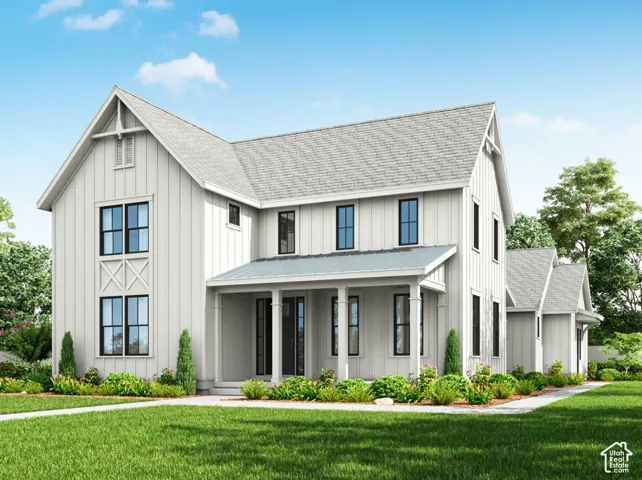 Contemporary farmhouse exterior with vertical board siding, covered porch, and black-framed windows
