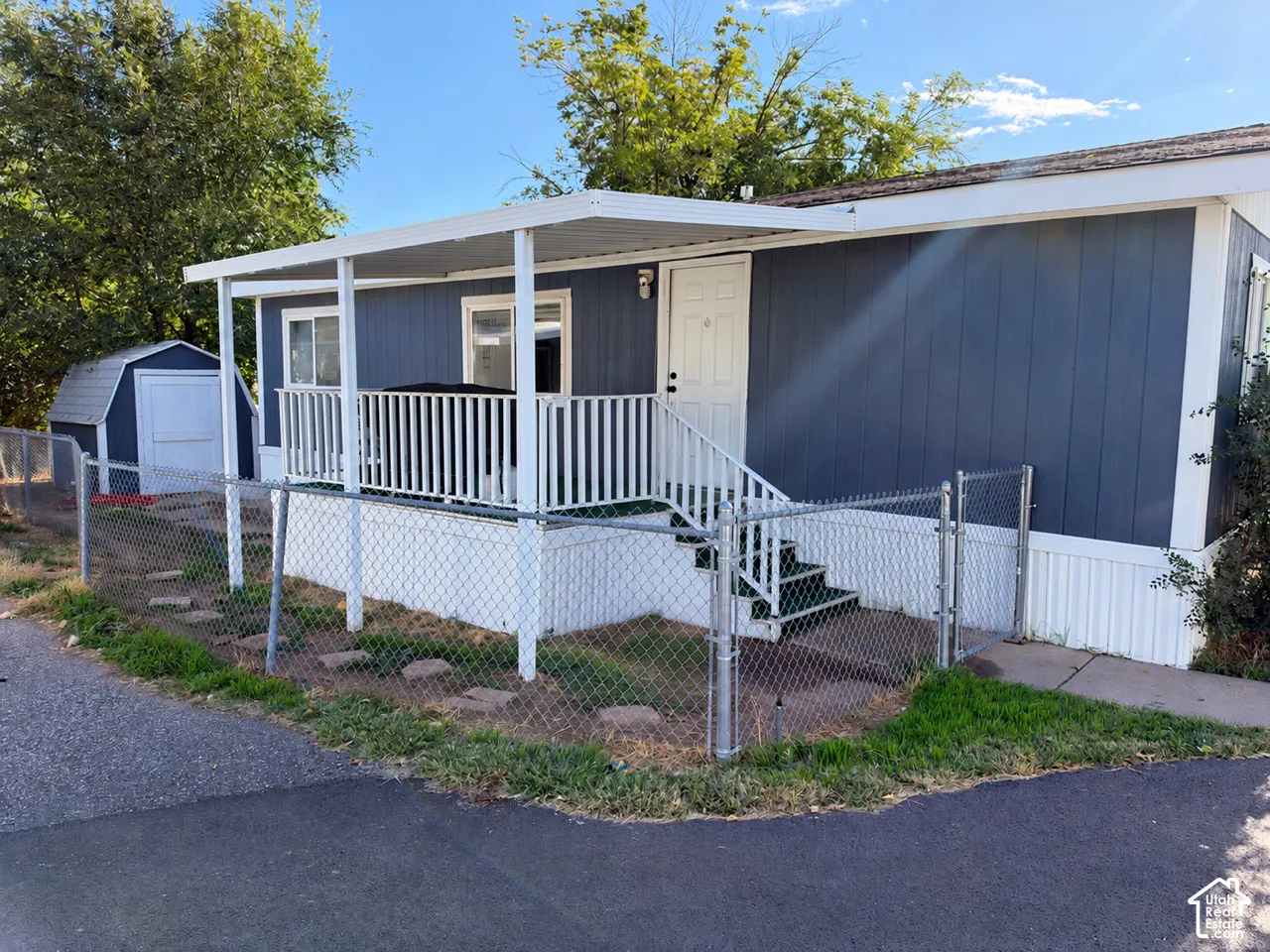 Blue exterior siding with white trim