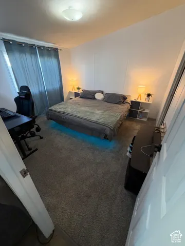Wall-to-wall carpeting and white walls