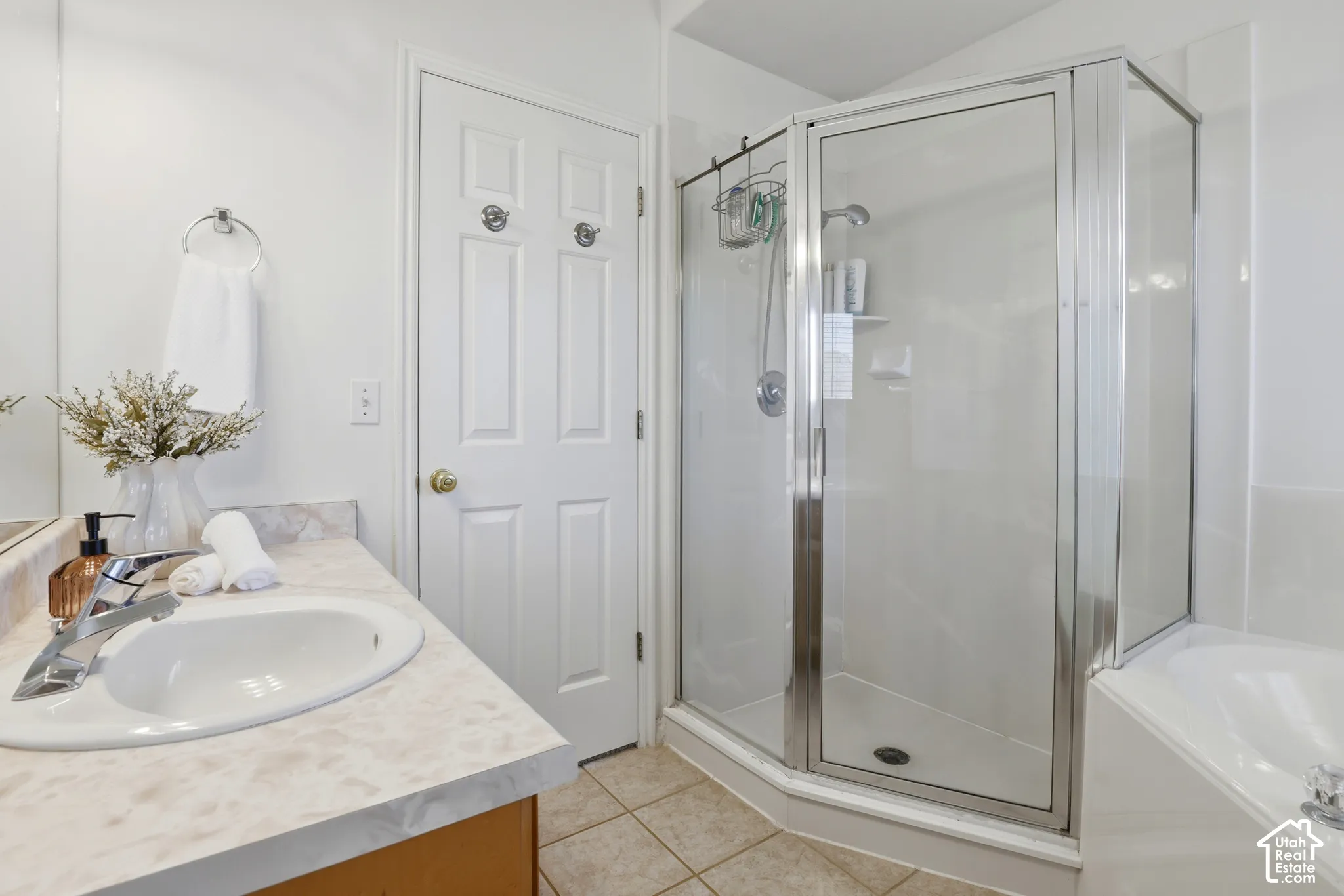 Vanity with an integrated sink, polished chrome faucet, and spacious countertop