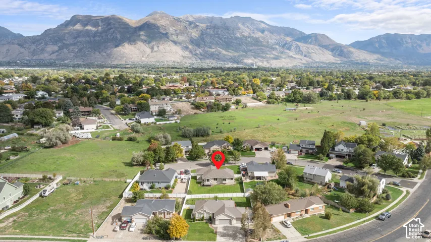 Mountain backdrop with expansive green spaces