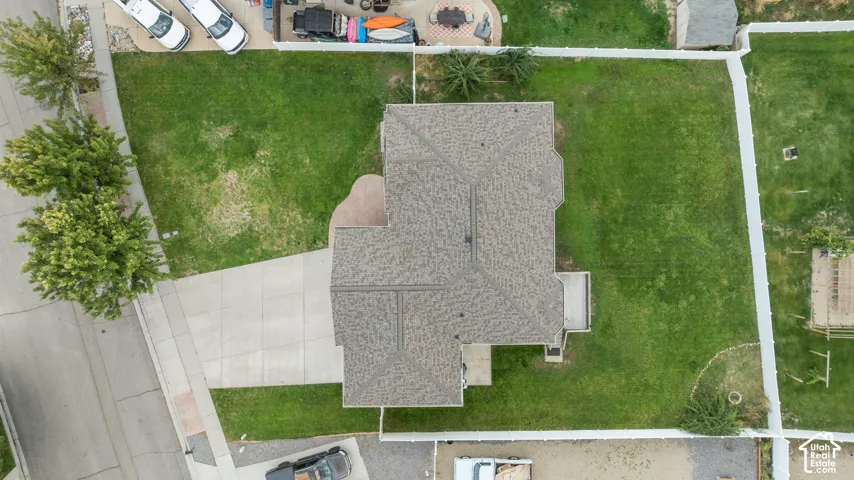 Expansive green lawn surrounds the property