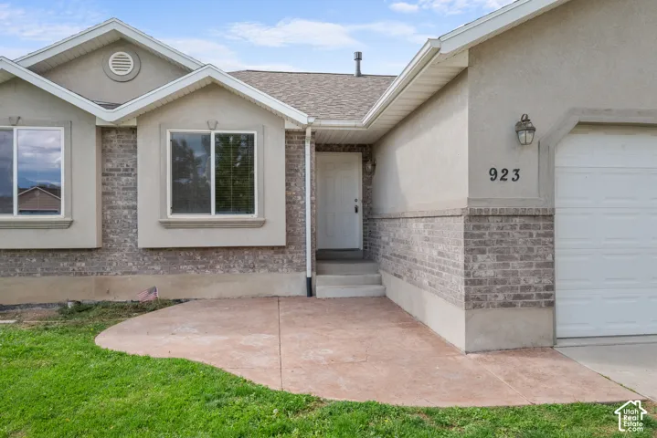 Stucco and brick exterior with contrasting trim